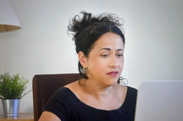 Rowena at her desk during an online counselling session